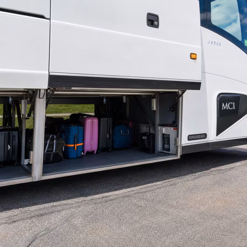 Party bus interior with wraparound leather seating and LED lighting in Fontana