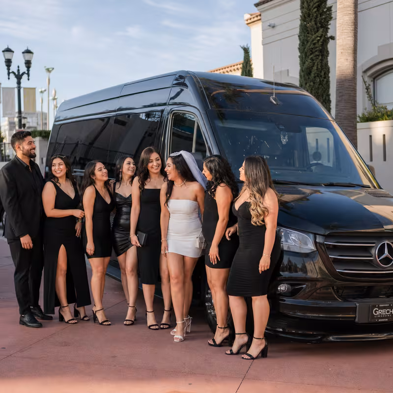 Group boarding a white charter bus for Bachelor & Bachelorette Transportation transportation in Fontana