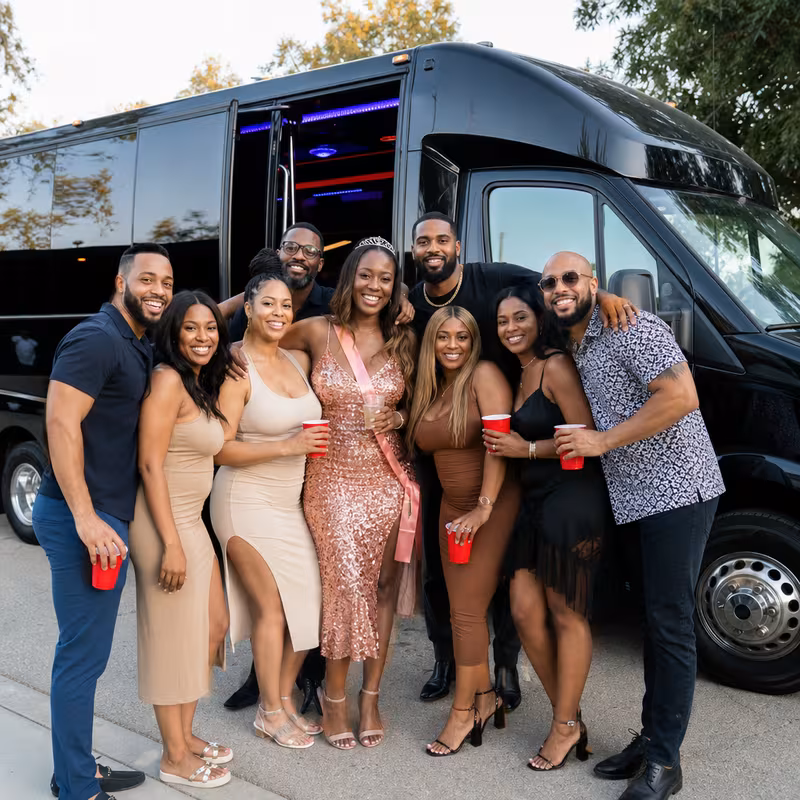 Group boarding a white charter bus for Birthday Transportation transportation in Fontana