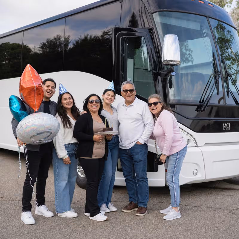 Passengers loading luggage while boarding an Fontana group shuttle