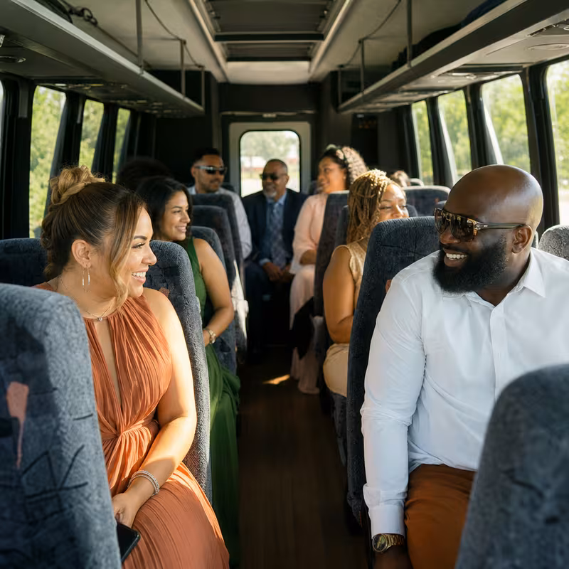 Group boarding a white charter bus for Private Event Transportation transportation in Fontana
