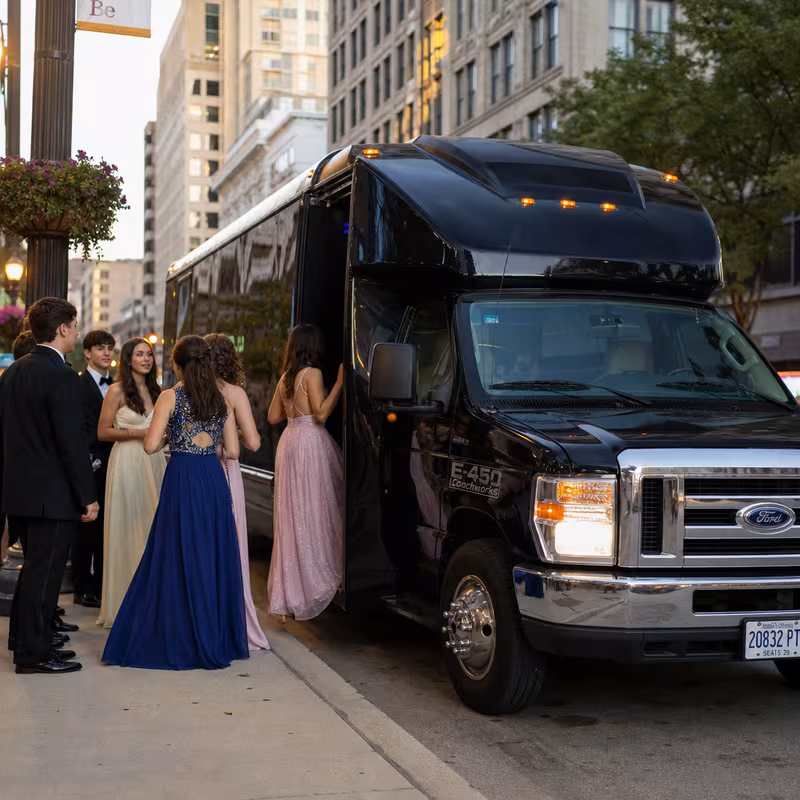 Passengers loading luggage while boarding an Fontana group shuttle