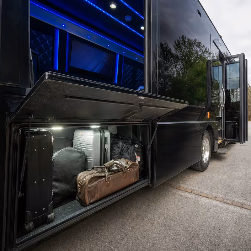 Party bus interior with wraparound leather seating and LED lighting in Fontana