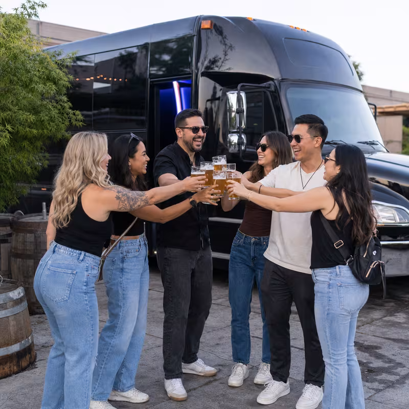 Passengers loading luggage while boarding an Fontana group shuttle